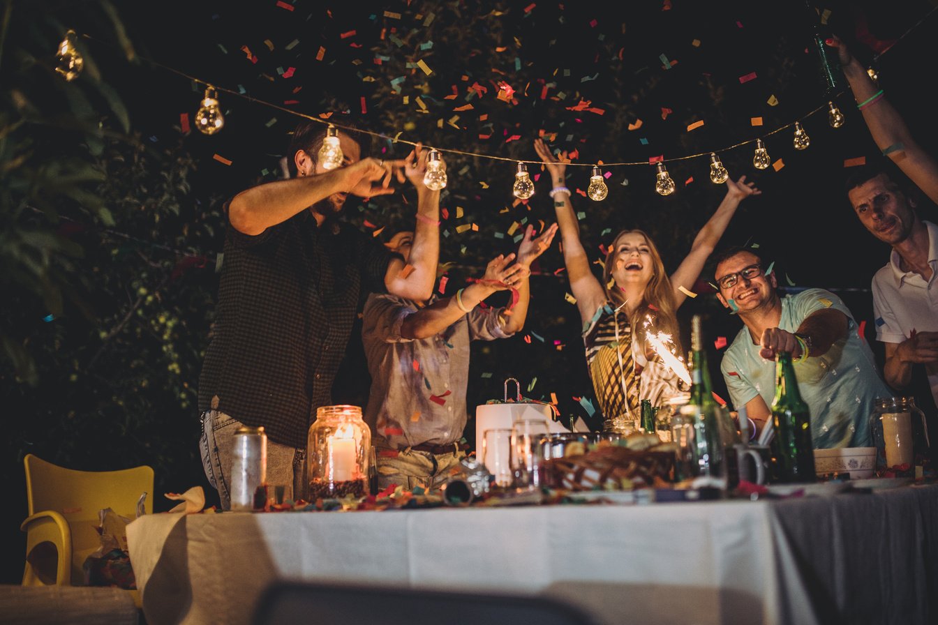 Friends enjoying at backyard party